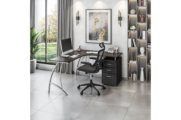 This modern Techni Mobili L-Shaped Computer Desk features a spacious desktop in a cool curved boomerang shape, it has a built-in locking storage cabinet and a hanging file cabinet for providing optimal storage.Heavy-duty MDF wood panels with a moisture resistant PVC laminate veneer | Space saving L-shape design with curved boomerang shape and interchangeable desks left or right | Curved powder-coated steel scratch resistant legs | Built-in locking storage cabinet and two accessory drawers | 5 Year Limited Warranty | Ships in 2 boxes
