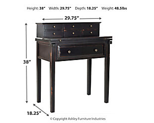 Work in style and convenience with the Abigail 7-drawer fold down desk. Modeled after an antique roll top desk, but with 21st century appeal, this desk is charming and functional. Its fold-down top gives you the option of opening up an instant workspace when needed. Six small drawers are ideal for organizing desk supplies and the large bottom drawer is handy for keeping notepads and more within reach. You'll love the distressed black finish, which provides a new twist on traditional style. Designed for small spaces, this desk is perfect for creating an instant office in the bedroom, kitchen, guest room or anywhere in between.Made of veneers, wood and engineered wood | Distressed black finish | Zinc-tone hardware | Fold-down top, 7 drawers | Assembly required