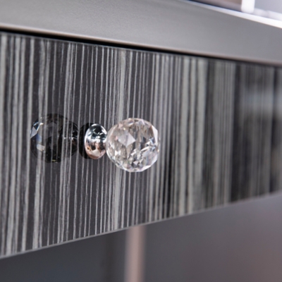 Crystal knob on striped drawer close-up