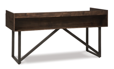 For fans of urban industrial design, the Starmore desk steals the show. Its top is crafted with a mix of acacia veneer and wood beautified with an oiled walnut-tone finish. A sleek tubular metal frame and linear, large-scale pulls pull it all together. The cutout shelf on the desk’s front side incorporates added dimension.Top made with wood, acacia veneers and engineered wood | Dark bronze-tone tubular metal legs and pulls | 3 smooth-gliding drawers with dovetail construction | Assembly required | Estimated Assembly Time: 15 Minutes