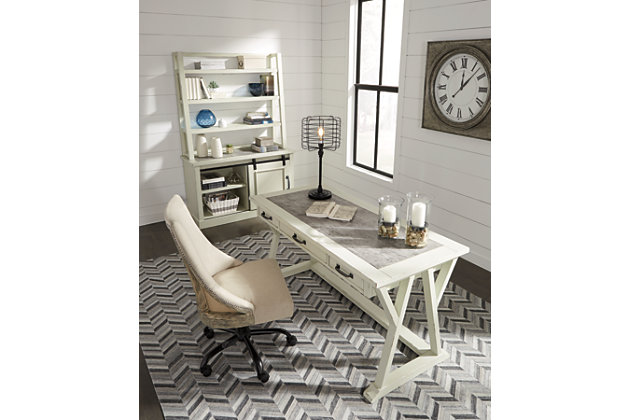 Can’t decide between farmhouse or industrial style? Make a striking compromise with the Jonileene home office desk. Generously scaled and loaded with charm, it includes a trio of smooth-gliding drawers to help you stay organized. Faux cement top adds another layer of interest.Made of veneers, wood and engineered wood with faux cement cabinet top | Distressed white finish | 3 smooth-gliding drawers | Dark gray finished hardware | Estimated Assembly Time: 30 Minutes