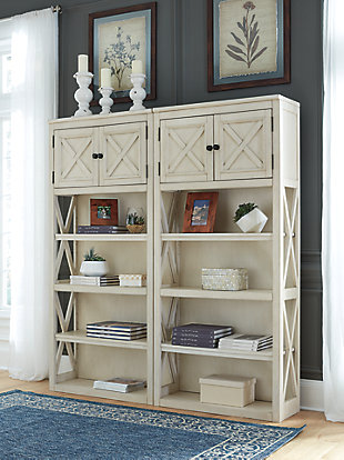 Whether your style is farmhouse fresh, shabby chic or country cottage, you'll find the Bolanburg tall bookcase works on so many levels. A gently distressed antiqued white finish and crossbuck detailing give this striking bookcase distinctive charm. Trio of shelves and double-door cabinet provide plenty of storage in a space-efficient way.Made of veneers, wood and engineered wood | Antiqued white finish | Gentle distressing | 3 shelves (2 adjustable and 1 fixed) | Double door cabinet | Estimated Assembly Time: 45 Minutes