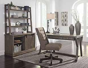 Work the latest trend in casual farmhouse living with the Luxenford home office desk. Elements include distinctive cross brace with stretcher styling and a wire brushed gray-brown finish that’s so easy on the eyes. Making this home office desk all the more unique: a faux bluestone inset on the desk top for a mixed media twist. Three smooth-gliding drawers with brushed nickel-tone pulls help keep you organized and on task.Made of white oak veneers, wood and engineered wood | Desk top with faux bluestone inset | Wire brushed gray-brown finish with metallic undertones | 3 smooth-gliding drawers | Brushed nickel-tone hardware | Assembly required | Estimated Assembly Time: 30 Minutes