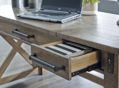 Crafted with pine veneers and wood treated to a distressed gray finish, the Aldwin lift top desk is rustic farmhouse living at its best. Crossbuck styling adds striking flair, while metal industrial brackets incorporate an industrial twist. Elevating the functionality of this lift top desk all the more: two smooth-gliding drawers and conveniently placed AC power/USB plug-ins.Made of pine veneers, pine wood and engineered wood | Distressed gray finish | Metal bracket accents | 2 smooth-gliding drawers with dovetail construction | 2 electrical outlets and 2 USB charging ports | Power cord included; UL Listed | Spring lift top | Assembly required | Estimated Assembly Time: 30 Minutes