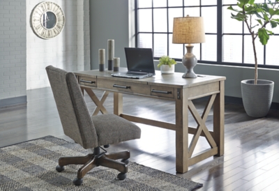 Crafted with pine veneers and wood treated to a distressed gray finish, the Aldwin lift top desk is rustic farmhouse living at its best. Crossbuck styling adds striking flair, while metal industrial brackets incorporate an industrial twist. Elevating the functionality of this lift top desk all the more: two smooth-gliding drawers and conveniently placed AC power/USB plug-ins.Made of pine veneers, pine wood and engineered wood | Distressed gray finish | Metal bracket accents | 2 smooth-gliding drawers with dovetail construction | 2 electrical outlets and 2 USB charging ports | Power cord included; UL Listed | Spring lift top | Assembly required | Estimated Assembly Time: 30 Minutes