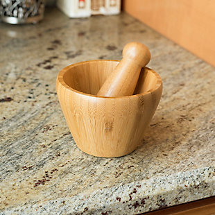 Maximum flavor extraction from your favorite fragrant herbs and spices is something you'll never miss when you have this mortal and pestle at your fingertips. The large pestle pulverizes ingredients quickly, unleashing their full flavor with little and minimal effort. Both pestle and mortar are crafted out of solid bamboo and are substantial in weight to prevent slipping and sliding off your work surface.  This convenient kitchen gadget is great for grinding seeds and peppercorns for smoking rubs or for pulverizing a whole avocado for a creamy and savory guacamole sauce. The finish is smooth to the touch so that you can extract the full flavor without having herbs and spices getting stuck on the sides.   Instead of busting out the blender and dealing with the messy aftermath opt to use this bamboo mortar and pestle to get the job done right!Perfect for grinding and crushing herbs and seasonings to unlock their savory scent and full flavor | Smooth finish is gentle on the hands | Pestle is crafted with unpolished ends for optimal mashing and crushing | Made of eco-friendly bamboo