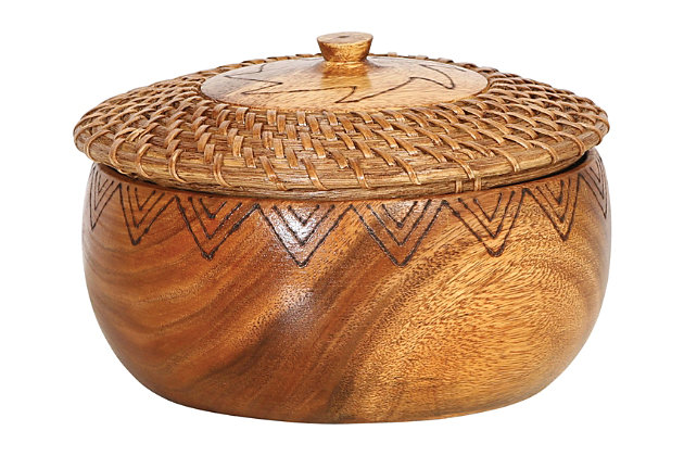The gorgeous wood grains of this round wood and woven rattan bowl make a unique and distinctive statement sure to attract attention. Its contents will be kept securely hidden undeath an amazing decorative lid with burned design. When not in use, this warm, beautifully patterned bowl can be displayed on a shelf or table as an amazing decorative accent.Made of acacia wood and rattan | Round wood bowl | Single woven rattan and wood lid | Imported