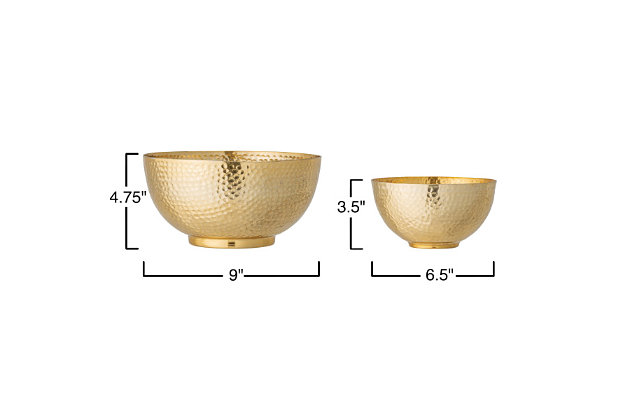This set of gorgeous metal bowls is the perfect statement piece to add to any kitchen. The lavish matte goldtone hammered finish allows it to stand out from regular kitchen bowls and fit in with any style of decor.Set of 2 | Made of metal | Goldtone finish | Hand wash | Imported