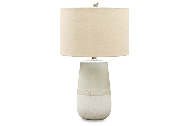 With a textured neutral glaze, the Shavon table lamp brings thoughts of sun, surf and sand to your space. Turn coastal chic to the contemporary side with this transitional lamp.Made of glazed ceramic with fabric drum shade | 3-way switch | 1 type A bulb (not included); 150 watts max or 25 CFL watts max; UL Listed | Assembly required | Estimated Assembly Time: 15 Minutes