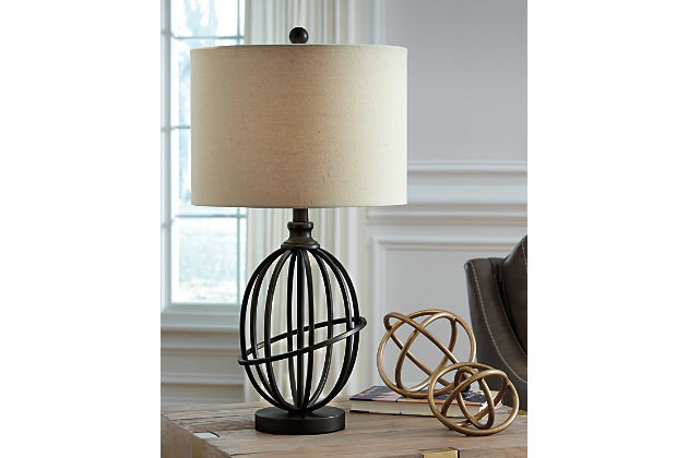 Manasa table lamp's armillary-inspired design illuminates your home with revolving style. Complemented by a dark brown finish, it's a sophisticated match for your traditional decor.Made of dark brown finished metal with fabric drum shade | 3-way switch | 1 type A bulb (not included); 100 watts max or CFL 23 watts max; UL Listed | Clean with a soft, dry cloth | Assembly required | Estimated Assembly Time: 15 Minutes