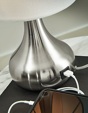 With its sleek metal droplet body, topped with a white drum shade, the Camdale table lamp creates an engaging look. A single USB charging port keeps your electronics up and running at all times. Place this lamp in the living room for a radiant focal point that speaks to the educated eye, or use it in the boudoir for an opulent touch. Made of metal and drum hardback fabric shade | Brushed silvertone finish | USB charging port | On/off switch | 1 E26 socket; type A bulb recommended (not included); 40 watts max or CFL 8 watts max; UL listed | Assembly required