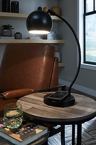 Don’t let lighting throw you for a loop. The beautiful curve of the Marinel lamp will add the right contour to your space. With a classic black finish, the arc of this lamp ends with an adjustable metal shade. The integrated wireless charging and USB port add a convenient way to keep your devices powered.Made of metal | Black finish | Adjustable shade | On/off switch | 1 type A bulb (not included); 40 watts max or CFL 8 watts; UL Listed | USB and wireless chargers in the base | Assembly required