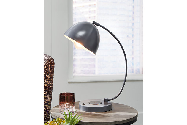 A beautiful accent to your desk, the Austbeck lamp with its adjustable dome shade casts cool shadows as it suspends from a dramatic stem. Featuring a wireless charging pad and 1 USB charging port, you can charge up without cords or clutter. Turn on your decor with this on-trend accent lamp in any space, and give a nod to contemporary style with the flip of a switch.Made of metal with adjustable metal shade | Gray finish | Wireless charger and 1 USB charging port | On/off switch | 1 type G bulb (not included), 40 watts max or CFL 8 watts max; UL Listed | No assembly required