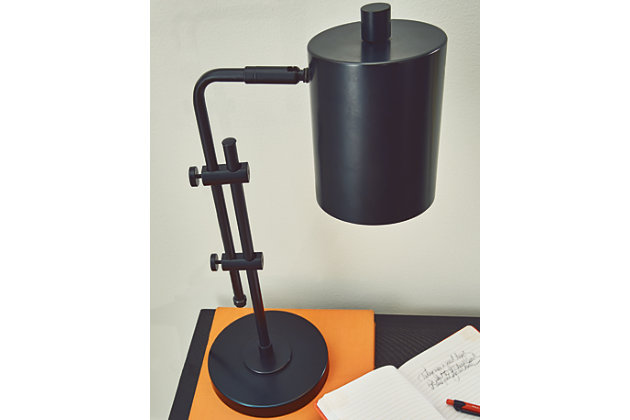 Inspired by contemporary lighting designs, the Baronvale metal desk lamp features a slender black profile with a simple metal shade. An adjustable neck and shade provide targeted illumination.Made of metal with metal shade | Black finish | On/off switch | Adjustable arm and neck | 1 E26 socket; type A bulb recommended (not included); 40 watts max or CFL 8 watts max; UL Listed | Assembly required