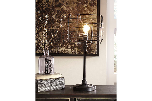 Love industrial cool style? You’re sure to be floored by this retro-chic metal table lamp. Factory inspired cage shade exposes the bulb, bringing home a touch of nostalgia that feels delightfully relevant.Made of metal with metal shade | On/off switch on cord | 1 type A bulb (not included); 60 watts max or CFL 13 watts max; UL Listed | Assembly required | Clean with a soft, dry cloth | Estimated Assembly Time: 15 Minutes