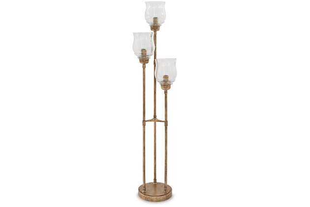 With the Emmie floor lamp, stand-up style is a no brainer with its goldtone metal and glass shades. Varying height bulbs cascade light for maximum impact beside an accent chair or mirror. No more fumbling around in the dark—the easy foot switch simplifies adding extra light to the room whenever you need it.Made of antiqued goldtone metal with glass shades | On-off foot switch | 3 type A bulbs (not included); 40 watts max or CFL 8 watts max; UL Listed | Assembly required | Clean with a soft, dry cloth | Estimated Assembly Time: 15 Minutes