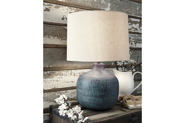 Pedal to the metal—or in this case, aluminum. The Malthace table lamp offers so much eye-catching detail with the detailed patina bronze finish and hammered effect. Gourd shape has a casual vibe that’s easy to love, and even easier to match with existing decor.Made of patina bronze-tone hammered aluminum with modified drum shade | 3-way switch | 1 type A bulb (not included); 150 watts max or CFL 25 watts max; UL Listed | Clean with a soft, dry cloth | Assembly required | Estimated Assembly Time: 15 Minutes