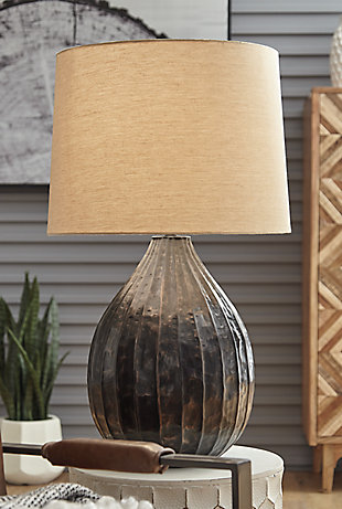 Add a handcrafted element to your room with the Marloes metal table lamp. With a striking combination of antique goldtone and copper-tone hues, this gorgeous gourd lamp shines a light on casually cool style.Made of metal with fabric modified drum shade | 3-way switch | 1 type A bulb (not included); 150 watts max or CFL 25 watts max; UL Listed | Due to handcrafted nature of this product, some variations may occur | Assembly required | Estimated Assembly Time: 15 Minutes