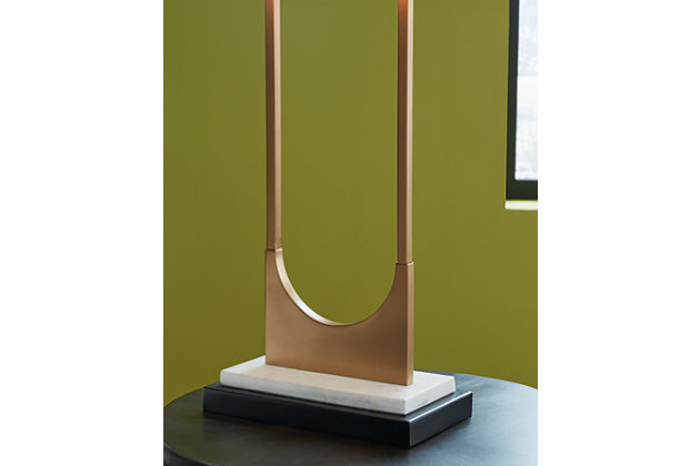 The open metal brass-tone frame adds elegant style to the look of the Malana table lamp. It features a black rectangle shade, brass and black metal finish, white marble base and a 3-way switch. It is built with sheer perfection and adds a dazzling glow to your spaces.Metal and marble with black fabric hardback shade | Brass-tone and black metal finish | White marble base | 1 type A bulb (not included), 150 watts max or CFL 25 watts max; UL Listed | Due to the use of natural materials, some variations may occur | Minor assembly required | Estimated Assembly Time: 15 Minutes