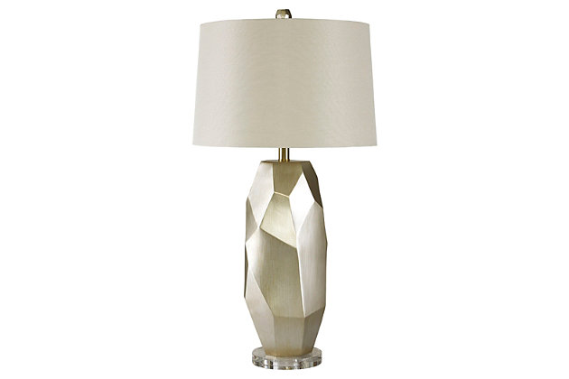 Inspired by modern art sculptures, the Darda table lamp casts a light on originality. Free form shape naturally goes with the flow. Subtle metallic finish has a lovely hint of sheen.Made of resin and acrylic with fabric drum shade | 3-way switch | 1 type A bulb (not included); 150 watts max or CFL 25 watts max; UL Listed | Clean with a soft, dry cloth