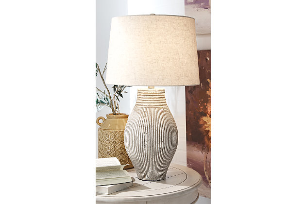 With its textural elements and neutral hues, the Layal table lamp is a natural fit for so many spaces. Paper composite base with organic texture feels wonderfully at home.Made of composite paper with modified drum shade | 3-way switch | 1 type A bulb (not included); 150 watts max or CFL 25 watts max; UL Listed | Assembly required | Estimated Assembly Time: 15 Minutes
