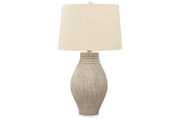 With its textural elements and neutral hues, the Layal table lamp is a natural fit for so many spaces. Paper composite base with organic texture feels wonderfully at home.Made of composite paper with modified drum shade | 3-way switch | 1 type A bulb (not included); 150 watts max or CFL 25 watts max; UL Listed | Assembly required | Estimated Assembly Time: 15 Minutes