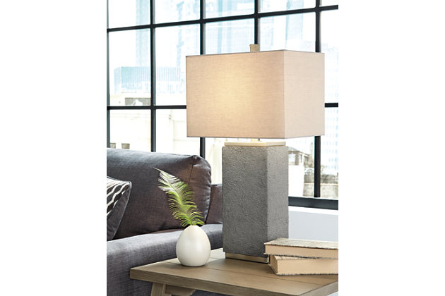 Faux concrete and a brushed silver finish set the Amergin table lamp apart from the rest. It’s contemporary and chic and will show off your eclectic taste.Made of poly resin and metal with fabric hardback shade | 3-way switch | 1 type A bulb (not included); 150 watts max or CFL 25 watts max; UL Listed | Clean with a soft, dry cloth | Assembly required | Estimated Assembly Time: 15 Minutes
