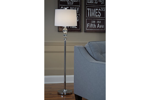 Have a ball beautifying your space with the Joaquin floor lamp. If you’re looking for a clean, ultra-contemporary aesthetic, you’re sure to find this floor lamp’s blend of crystal and chrome-tone metal so delightful. Simply chic drum shade is the perfect complement.Made of metal with crystal accents and fabric drum shade | 3-way switch | 1 type A bulb (not included); 150 watts max or CFL 25 watts max; UL listed | Clean with a soft, dry cloth | Assembly required | Estimated Assembly Time: 15 Minutes