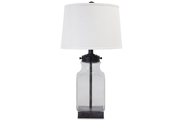 New turn on an old classic. The delightfully styled Sharolyn table lamp is brimming with vintage-inspired charm. Elements include antiqued silvertone metal paired with a smoky glass base and a modified drum shade for a crisp, clean touch.Lamp base made of smoky glass and antiqued silvertone metal | Fabric modified drum shade | 3-way switch for task lighting | 1 type A bulb (not included); 150 watts max or CFL 25 watts max; UL listed | Ideal complement to modern farmhouse and vintage-inspired decor | Clean with a soft, dry cloth | Assembly required