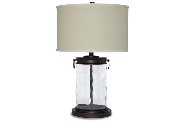 Light waves ahead. Wowing with a clear wave glass design, the Tailynn table lamp is delightfully chic and unique. Classic drum shade is perfectly in tune with cylinder shape base.Made of wave glass and metal with fabric drum shade | 3-way switch | 1 type A bulb (not included); 150 watts max or 25 watts max CLF; UL Listed | Clean with a soft, dry cloth | Assembly required | Estimated Assembly Time: 15 Minutes