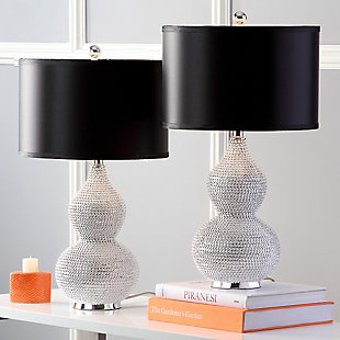 Let your room radiate in the shimmery glamour of this beaded table lamp set. Crafted of poly resin with a double gourd body, this shapely duo is completely encrusted with tiny silvertone beads. Topped with a black satin shade for clean, modern polish.Set of 2 | Made of resin with fabric shade | On/off switch | Cfl bulb; 13-watt bulb included | Wipe with a soft, dry cloth; avoid use of chemicals and household cleaners as they may damage finish | Assembly required