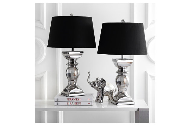Modeled after the style of classic European balusters, this table lamp set adds soft, lustrous light that's a welcome addition to a living room side table or bedroom nightstand. Shimmery silvertone base is paired with a black velvet hardback shade for upscale flair.Set of 2 | Made of ceramic with fabric shade | On/off switch | Cfl bulb; 13-watt bulb included | Wipe with a soft, dry cloth; avoid use of chemicals and household cleaners as they may damage finish | Assembly required