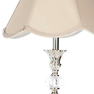 Inspired by the works of Europe’s great master craftsmen, this glass candlestick lamp is a posh addition to any interior. Place on a dining room buffet to serve a Versailles-worthy dinner, or beautify the boudoir to inspire dreams of romance. Scalloped taupe shade adds a touch of whimsy. Sold as a set of two.Set of 2 | Made of resin and glass with fabric shade | On/off switch | Cfl bulb; 13-watt bulb included | Wipe with a soft, dry cloth; avoid use of chemicals and household cleaners as they may damage finish | Assembly required