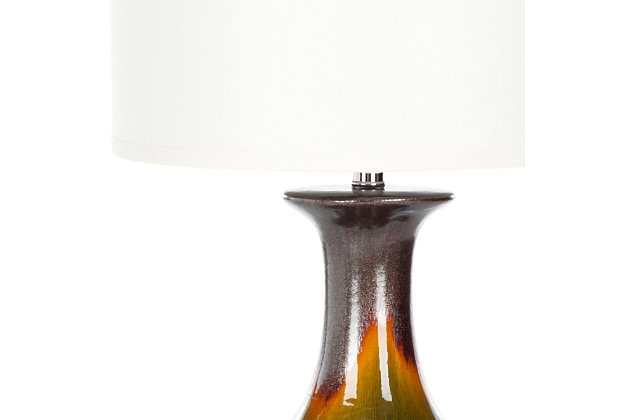If you dream of Jeannie, then this designer table lamp is your wish granted. Beautifully turned base is crafted of glazed ceramic with an ombre effect and stunning glimmer. Simple off-white cotton hardback drum shade is the perfect topper.Made of ceramic with fabric shade | On/off switch | Cfl bulb; 13-watt bulb included | Wipe with a soft, dry cloth; avoid use of chemicals and household cleaners as they may damage finish | Assembly required