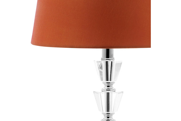 Crystal vision. A clear choice for those with a modern sensibility, this crystal table lamp with faceted crystal orb base masters the art of understated elegance. Touches of chrome-tone metal and a crisp linen shade perfect the aesthetic.Set of 2 | Made of crystal and chrome-tone metal with fabric shade | On/off switch | Cfl bulb; 13-watt bulb included | Wipe with a soft, dry cloth; avoid use of chemicals and household cleaners as they may damage finish | Assembly required