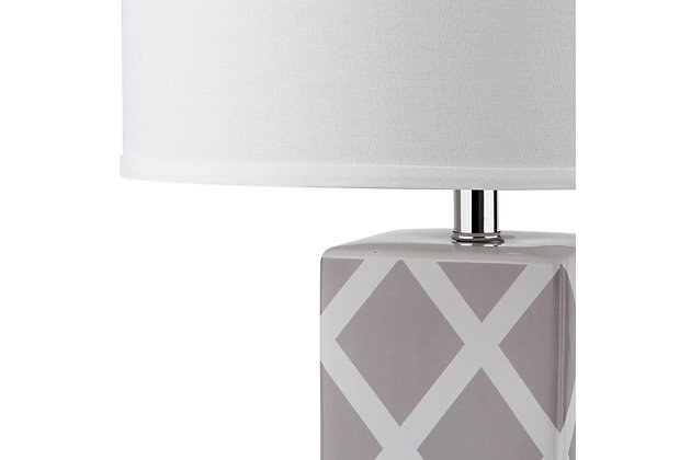 Forever plaid takes on new meaning with this delightful lattice design table lamp. Crafted of gray and white ceramic with a clear acrylic base and a silvertone neck, this graphic pattern is topped with a contemporary off-white drum shade.Set of 2 | Made of ceramic with fabric shade | 1 type a bulb (not included); 40 watts max or cfl 13 watts max | Assembly required | Clean with a soft, dry cloth