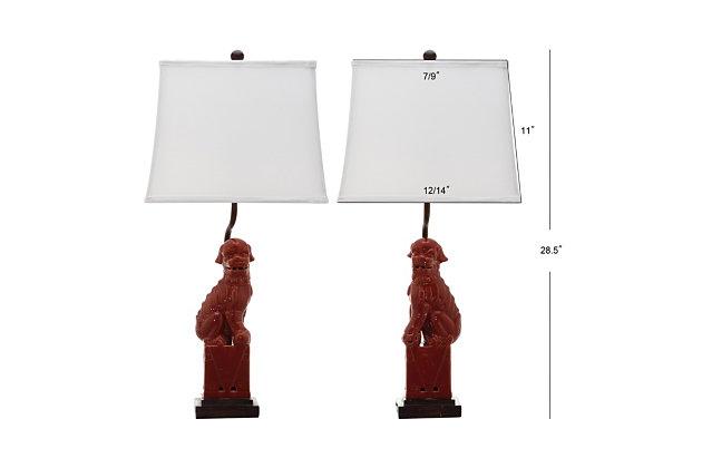 With a nod to the Far East, these stately foo dog table lamps add a worldly touch to any room.  Delightfully different, they're crafted of ceramic with pure cotton shades and contrasting brown stand and fittings.Set of 2 | Made of crystal and resin with fabric shade | On/off switch | Cfl bulb; 13-watt bulb included | Wipe with a soft, dry cloth; avoid use of chemicals and household cleaners as they may damage finish | Assembly required