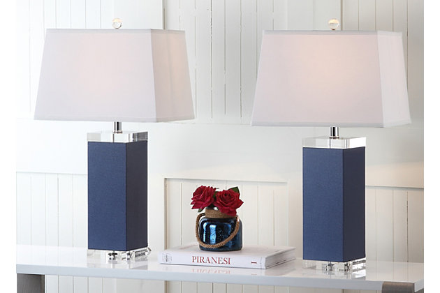 Inspired by a vintage piece perched on the concierge’s desk in one of London's five-star hotels, this table lamp is a modern luxury. An elegant navy finish and a faux leather texture make this a tastemaker favorite.Set of 2 | Made of polyurethane and metal with cotton shade | 1 type a bulb (not included); 40 watts max or cfl 13 watts max | Assembly required | Clean with a soft, dry cloth