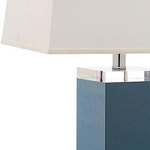 Inspired by a vintage piece perched on the concierge’s desk in one of London's five-star hotels, this table lamp is a modern luxury. An elegant marine blue finish and a faux leather texture make this a tastemaker favorite.Set of 2 | Made of polyurethane and metal with cotton shade | 1 type a bulb (not included); 40 watts max or cfl 13 watts max | Assembly required | Clean with a soft, dry cloth