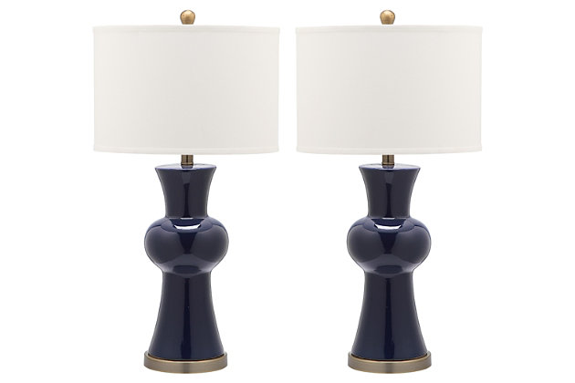 Perk up any room in the house with the young but sophisticated column lamp. With navy blue ceramic hourglass base cinched in the center and contrasting bronze base and fittings, this colorful set of two lamps is contrasted with crisp off-white shades.Set of 2 | Made of ceramic with fabric shade | 1 type a bulb (not included); 40 watts max or cfl 13 watts max | Assembly required | Clean with a soft, dry cloth