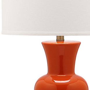 Add a designer aspect to your decor with this shapely table lamp. Place on either side of a living room armoire for a radiant focal point that speaks to the educated eye or use in the boudoir for an opulent touch.Set of 2 | Made of ceramic with fabric shade | 1 type a bulb (not included); 40 watts max or cfl 13 watts max | Assembly required | Clean with a soft, dry cloth