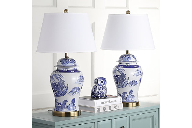 Inspired by antique Chinese porcelain ginger jars, this artisan table lamp adds a classic touch to traditional rooms. Crafted of ceramic in blue and white, it's topped with a textured cotton shadeSet of 2 | Made of ceramic with cotton shade | 1 type a bulb (not included); 40 watts max or cfl 13 watts max | Assembly required | Clean with a soft, dry cloth