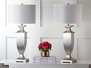 A satiny brushed nickel-tone finish lends an opulent effect to this classically shaped table lamp.  A graceful urn silhouette is updated for transitional rooms with a crisp white cotton drum shade.Set of 2 | Made of metal with cotton shade | 1 type a bulb (not included); 40 watts max or cfl 13 watts max | Assembly required | Clean with a soft, dry cloth