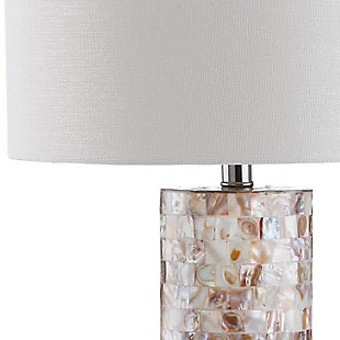 Fresh as an ocean breeze, this shell lamp adds just the right touch of glimmer beside a sumptuously decorated bed, or sophisticated sofa or chair. Crafted of natural capiz shell, the cylindrical base is accented with a silvertone neck and an ivory cotton shade.Set of 2 | Made of shell with cotton shade | 1 type a bulb (not included); 40 watts max or cfl 13 watts max | Assembly required | Clean with a soft, dry cloth