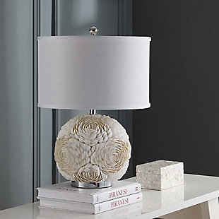 Shell artistry reigns in the distinctive base of this romantic  table lamp.  With large open blossoms crafted of individual seashells, this unique transitional lamp comes with a white textured cotton drum shade, for coastal chic appeal.Made of shell with cotton shade | 1 type a bulb (not included); 40 watts max or cfl 13 watts max | Assembly required | Clean with a soft, dry cloth