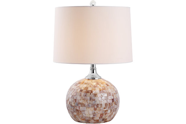 Inspired by the opulent discoveries of ancient pearl divers working in the Mediterranean, this luxurious shell table lamp is updated with the sheen of capiz shells in pearly tones from off white to pinkish brown. Finished in an elegant ivory color, its multi-tonal shimmer brings depth and character to any room.Made of shell with fabric shade | 1 type a bulb (not included); 40 watts max or cfl 13 watts max | Assembly required | Clean with a soft, dry cloth