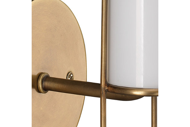 This designer wall sconce fuses glam and transitional styles for an intriguing mix. With its delicate linear metal details and white milk glass, this slim, sleek light fixture brings a splash of brilliance everywhere. Damp-rated design makes it an exceptional choice for powder rooms and covered porches, too.Made of antique brass-tone steel and glass | 40-watt bulb (not included); candelabra base (E-12) | Damp-rated design approved for use in covered outdoor areas and bathrooms | Hardwired; professional installation recommended | Assembly required