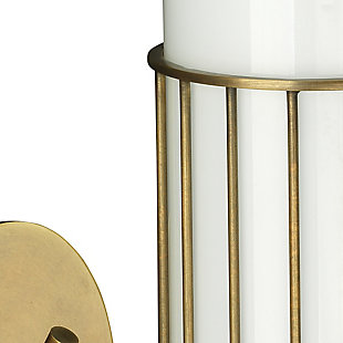 This designer wall sconce fuses mid century and modern influences for an intriguing mix. With its delicate metal wire shade holder and white milk glass cylinder, this slim, sleek light fixture brings a splash of brilliance everywhere. Damp-rated design makes it an exceptional choice for powder rooms and covered porches, too.Made of antique brass-tone steel and opaque white milk glass | 40-watt bulb (not included); medium base (E-26) | Damp-rated design approved for use in covered outdoor areas and bathrooms | Hardwired; professional installation recommended | Assembly required