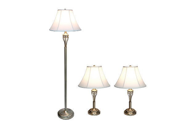 Accessorize your space with this tastefully designed lamp set. It includes 2 table lamps and 1 floor lamp, each with a white fabric shade to make beautifying your home a cinch! Each lamp is enriched with an exquisite Antique Brass finish. 
We believe that lighting is like jewelry for your home. Our products will help to enhance your room with elegance and sophistication.Set includes 2 table lamps and 1 floor lamp | Beautiful white fabric shades and exquisite antique brass  finish | Table lamps: height: 25.5”   shade diameter: 16" | Floor lamp: height: 60”  shade diameter: 16"