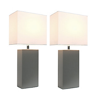 These fashionable table lamps, with their genuine leather bodies and white fabric shades, will add style and pizzazz to any room. We believe that lighting is like jewelry for your home. Our products will help to enhance your room with elegance and sophistication.Set includes 2  lamp bases and 2 shades | Leather wrapped base | White fabric shades | Assembled dimensions: l: 10" x w: 6" x h: 21"